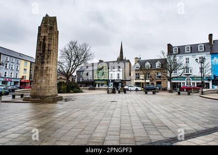 Main square in Donegal Town, Republic of Ireland on a gloomy day. There are no people around the shops, pubs and hotels all around the central plaza Stock Photo