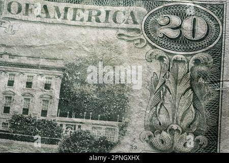 partial extreme closeup macro shot american dollar twenty 20 bill banknote word america part of white house Stock Photo