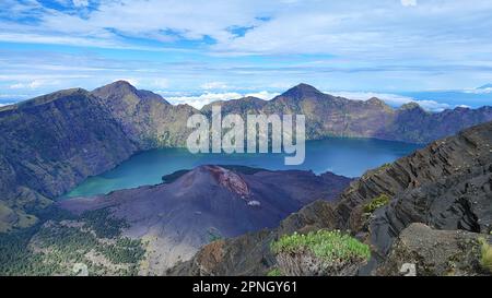 Amazing view of Lake Segara Anak and the crater rim from top of Mount Rinjani, Lombok, Indonesia Stock Photo