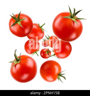 Small red cherry tomatoes floating on white background. Stock Photo