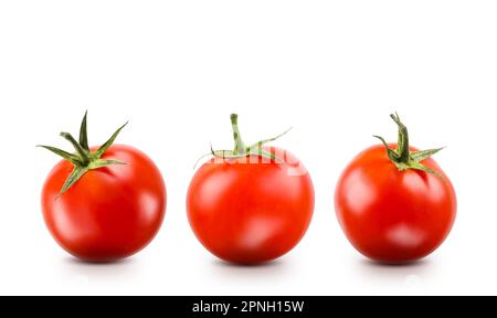 Small red cherry tomatoes on white background. Stock Photo
