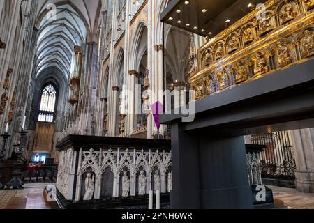 The Shrine of the Three Kings in Cologne Cathdreal on 6th April 2023 in Cologne, Germany. The Shrine of the Three Kings aka Der Dreikönigenschrein, or Tomb of the Three Magi is a reliquary traditionally believed to contain the bones of the Biblical Magi, also known as the Three Kings or the Three Wise Men. The shrine is a large gilded and decorated triple sarcophagus placed above and behind the high altar of Cologne Cathedral in western Germany. Built approximately from 1180 to 1225, it is considered the high point of Mosan art and the largest reliquary in the Western world. Stock Photo