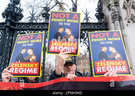 London UK. 19 April 2023. Protesters demonstrate outside the houses of parliament urging the UK and US government to stop funding the Ukraine war and Zelensky regime and to defend the UK borders  in reference to the  migrant crossings. Credit: amer ghazzal/Alamy Live News Stock Photo
