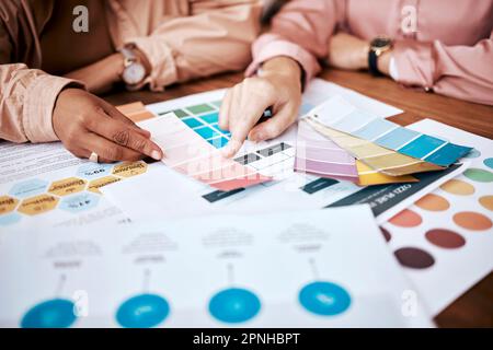 Creative business people, hands and color palette in planning, brainstorming or team strategy on office desk. Hand of graphic designers in teamwork Stock Photo