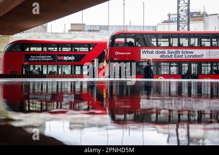 London, UK.  19 April 2023. Double decker buses are reflected in a water feature in the City of London, appearing to be submerged under the rising water.  Activists from Extinction Rebellion partnering with other climate change campaign groups have announced ‘The Big One’, a series of events taking place at the weekend in Westminster demanding that the UK Government take action on the effects of climate change and the impact on rising sea levels.  Credit: Stephen Chung / Alamy Live News Stock Photo
