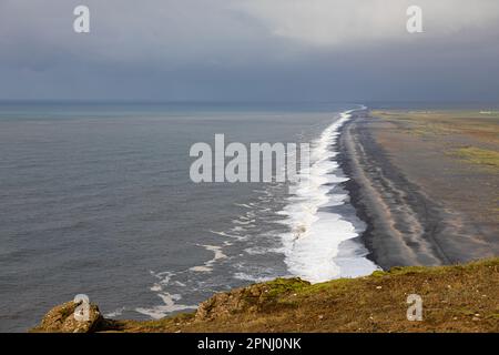 Iceland black beach Reynisfjara in Vik from Dyrholaey (Dyrhólaey) viewpoint. Coastline of black sand beach in Iceland. Stock Photo