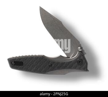 Partially opened self-defense knife with shadow behind Stock Photo