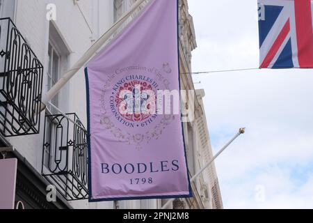 Bond Street, London, UK. 19th April 2023. Preparations for the coronation of King Charles III. Flags on Bond Street. Credit: Matthew Chattle/Alamy Live News Stock Photo