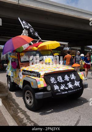 2023 Houston Art Car decorated with sticky notes and banners supporting the liberation of Hong Kong from China. Stock Photo