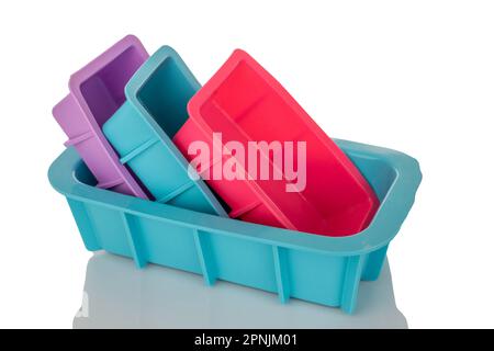 Several silicone molds for baking, macro, isolated on white background. Stock Photo