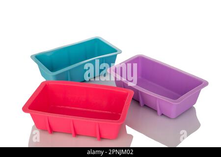 Three silicone molds for baking, macro, isolated on white background. Stock Photo