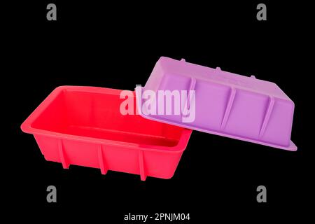 Two silicone molds for baking, macro, isolated on black background. Stock Photo