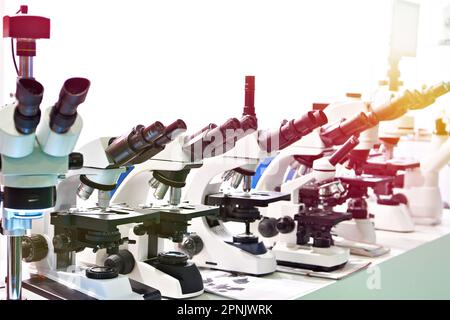Optical microscopes in the store at the exhibition Stock Photo