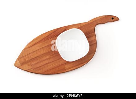 An empty white bowl on a cutting board. Blank bowl. Top view. Stock Photo