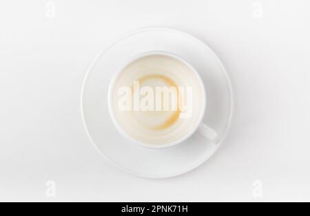 A cup of coffee drunk on a white background. Top view. Stock Photo
