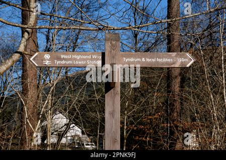 Fingerpost sign for the West Highland Way and Tyndrum Lower Station, Tyndrum, Scotland Stock Photo