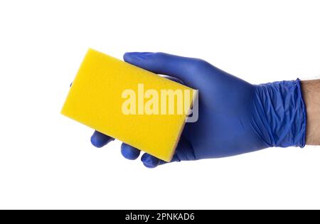 Sponge for washing and cleaning in male hand. Hand in a latex glove isolated on white. A hand in a glove holds a sponge for washing and cleaning. Stock Photo