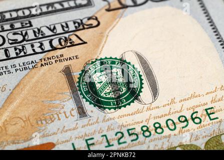 Extreme close-up of one hundred bill. Macro. American paper money. A $100 bill with focus on logo United States Department of the Treasury. US banknot Stock Photo