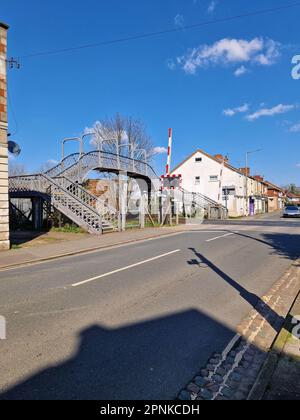 Old wrought iron footbridge over a railway crossing in Long Eaton, Derbyshire, UK Stock Photo