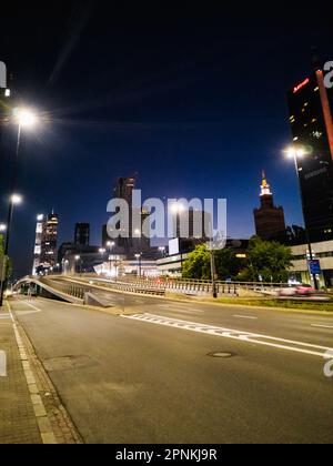 Warsaw, Poland - July 2022: Night panorama of Warsaw full of illuminated, modern skyscrapers Stock Photo