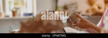 Female potter involved in work at her workshop Stock Photo