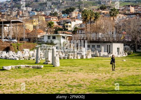 Tourist visits Agora Ören Yeri in Izmir, Turkey, a magnificent ancient site that showcases the remnants of a once-great marketplace and cultural hub. Stock Photo