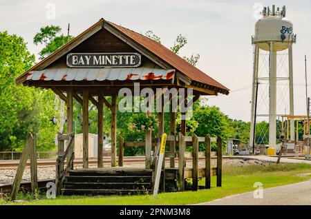 A rustic wooden platform stands alongside the railroad tracks near the original location of the Bay Minette train depot in Bay Minette, Alabama. Stock Photo
