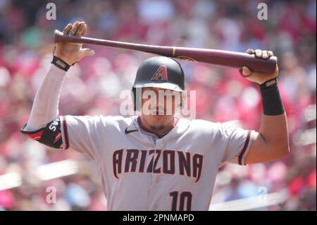 Arizona Diamondbacks' third baseman Lourdes Gurriel Jr. laughs as one of  his sons steals his hat before their game with the Cleveland Guardians,  Sunday, June 18, 2023, in Phoenix. (AP Photo/Darryl Webb