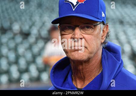 Toronto Blue Jays manager John Schneider (L) and bench coach Don Mattingly  walk to the dugout