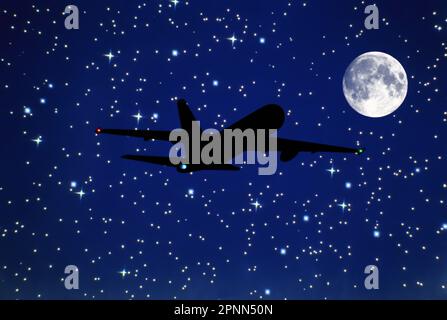 SILHOUETTE OF AIRBORNE BOEING 767 COMMERCIAL PASSENGER AIRCRAFT IN STARRY NIGHT SKY Stock Photo