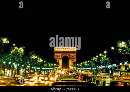 Avenue des Champs-Elysees in night lighting leading up to the Arc de Triomphe in Paris, France Stock Photo