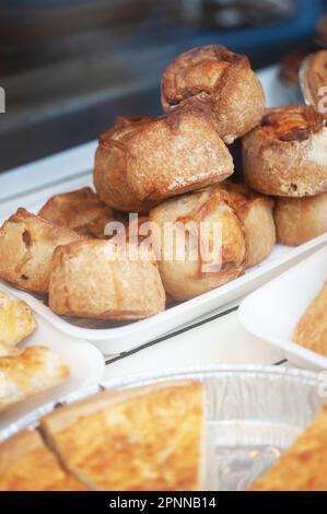 Pork pies in window of R Carter and Son, Butchers shop in Bamburgh, Northumberland Stock Photo