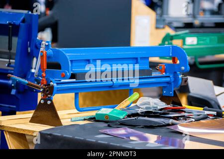 Manual roller bending machine. Metal sheet bending machine. Stock Photo