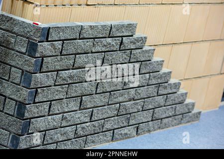 Facing the foundation made of decorative bricks. Stock Photo