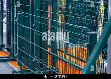 Green steel bar fence. Modern fencing systems. Stock Photo