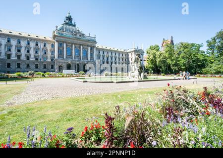 MUNICH, GERMANY - AUGUST 3: Tourists at the the old botanical garden in Munich, Germany on August 3, 2015. The park was opened 1812. Foto taken from Stock Photo