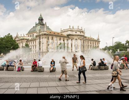 MUNICH, GERMANY - JULY 20: Tourists at Stachus fountain in Munich, Germany on July 4, 2015. Munich is the biggest city of Bavaria with almost 100 Stock Photo