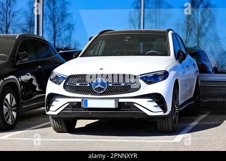 New white Mercedes-Benz 4matic luxury SUV car parked outside a dealership. Salo, Finland. April 10, 2023. Stock Photo