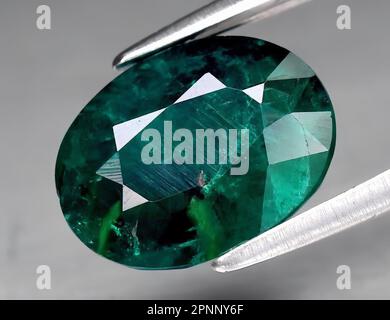 Natural gem green dioptase on a gray background Stock Photo