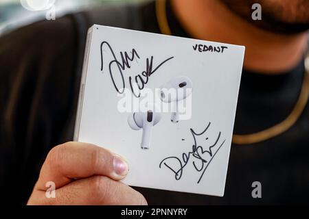 New Delhi, New Delhi, India. 19th Apr, 2023. Vedant, a fan of Apple products, holds an airpods after getting it autographed by Apple CEO Tim Cook and Deirdre O'Brien, Apple's senior vice president of Retail and People during the inauguration of the new Apple store. (Credit Image: © Karma Sonam Bhutia/ZUMA Press Wire) EDITORIAL USAGE ONLY! Not for Commercial USAGE! Stock Photo