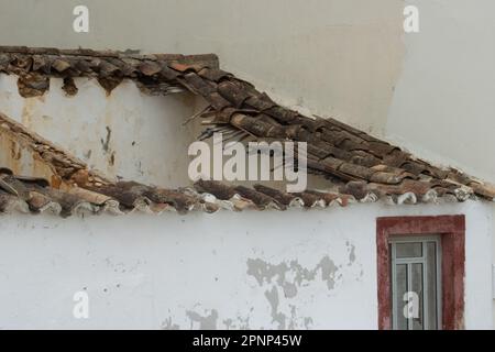 fallen roof with many fallen pan tiles in southern Portugal Stock Photo