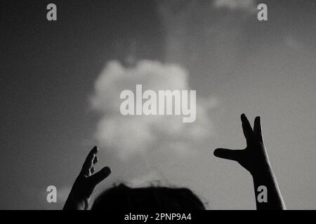 Child's hands holding cloud Stock Photo