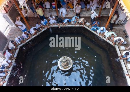 Kolkata, India. 19th Apr, 2023. Indian Muslims wash their hands from a water reservoir inside of Nakhoda mosque before offering their evening prayers to Allah during Ramadan in Kolkata. Credit: SOPA Images Limited/Alamy Live News Stock Photo