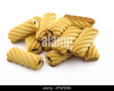 Shortbread cookies rectangular with filling. Shortbread cookies with jam on white background.  A pile of tube cookies stuffed with jam close-up. Stock Photo