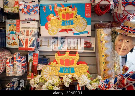 With two weeks before the coronation of King Charles III takes place, assorted royal merchandise is on sale in a party and balloon shop in Kensington, west London, on 19th April 2023, in London, England. King Charles will succeed Queen Elizabeth II on 6th May, who passed away last year. Stock Photo