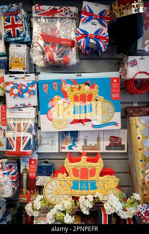 With two weeks before the coronation of King Charles III takes place, assorted royal merchandise is on sale in a party and balloon shop in Kensington, west London, on 19th April 2023, in London, England. King Charles will succeed Queen Elizabeth II on 6th May, who passed away last year. Stock Photo