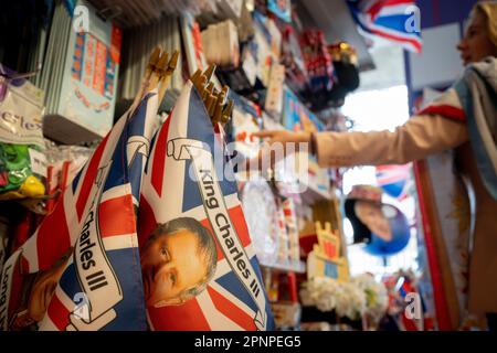 With two weeks before the coronation of King Charles III takes place, assorted royal merchandise is on sale in a party and balloon shop in Kensington, west London, on 19th April 2023, in London, England. King Charles will succeed Queen Elizabeth II on 6th May, who passed away last year. Stock Photo