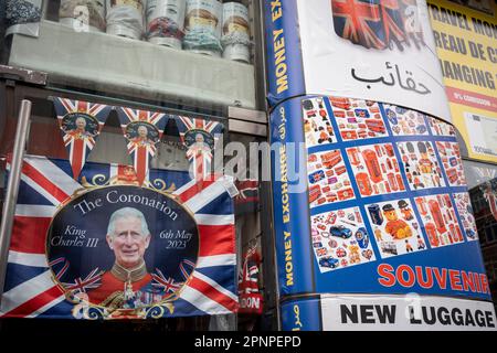 With two weeks before the coronation of King Charles III takes place, a flag souvenir is displayed outside a trinket shop business selling royal merchandise in Kensington, west London, on 19th April 2023, in London, England. King Charles will succeed Queen Elizabeth II on 6th May, who passed away last year. Stock Photo