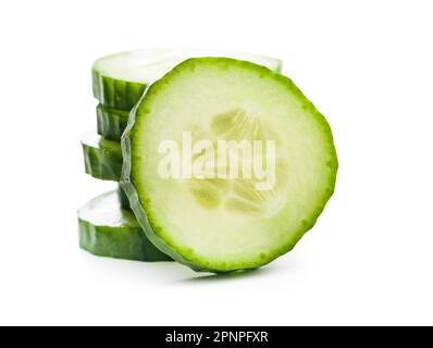 Sliced fresh green cucumber isolated on the white background. Stock Photo
