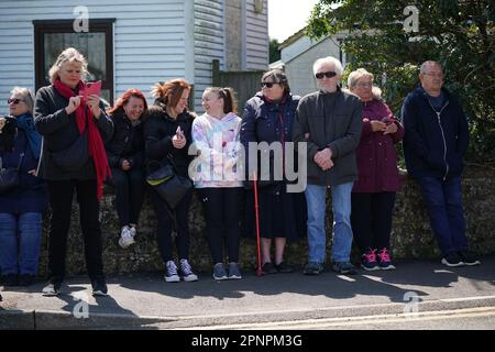 Wellwishers arrive at the Walnut Tree Pub in Aldington, Kent, as they wait for Paul O'Grady's funeral cortege to travel through the village of Aldington, Kent, ahead of his funeral at St Rumwold's Church. Picture date: Thursday April 20, 2023. Stock Photo